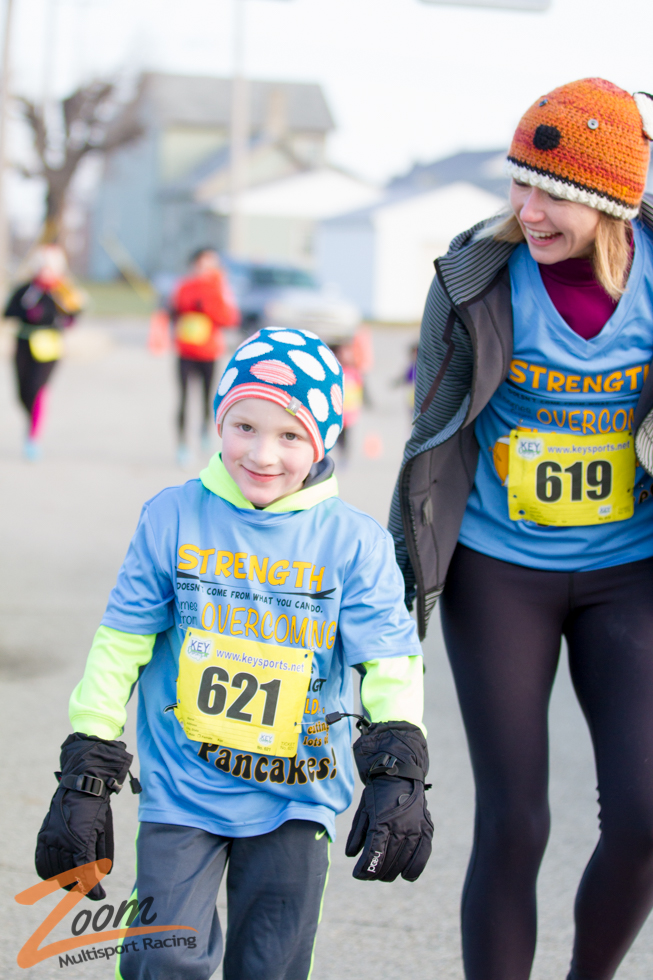 Pancakes and Resolutions Mom and Son Running