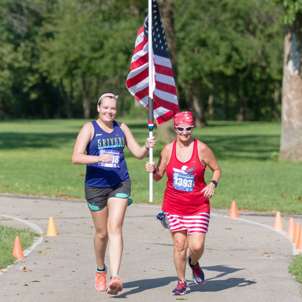 Runners Carrying Flag